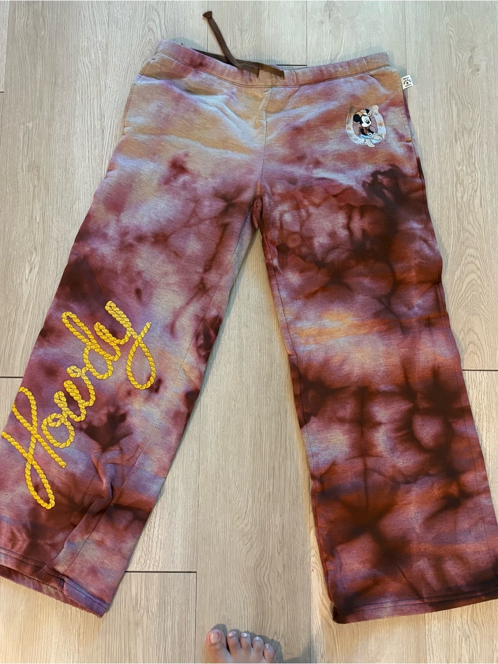 Disney Tie-Dye Sweatpants in Rust Brown with Yellow Graphic
